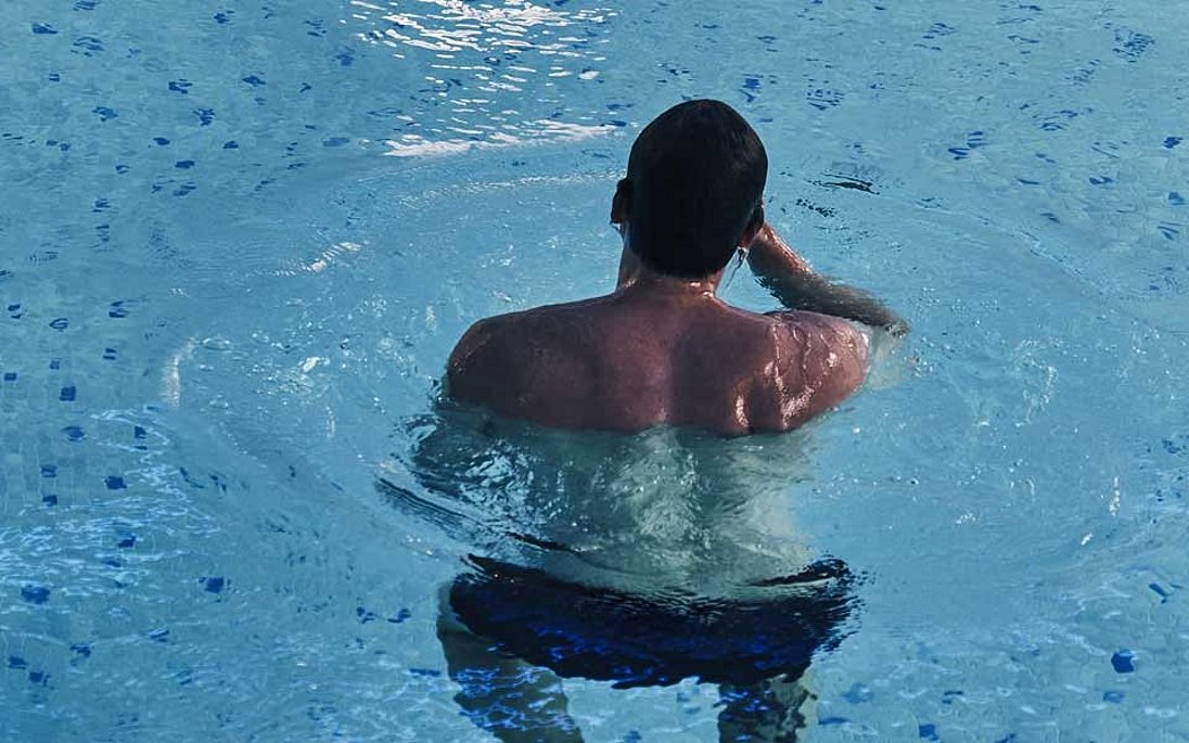 Man cools down in pool